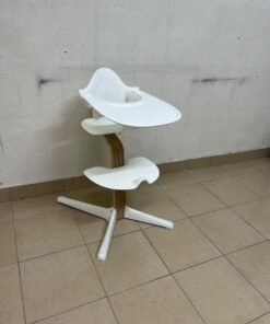 Stokke Nomi High Chair in white, complete with a Baby Set and a tray.