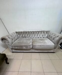 Classic Chesterfield-style furniture upholstered in velvet, featuring a long grey or silver sofa with a button-tufted backrest, accompanied by a matching armchair (fauteuil) in a dark green or olive shade, sharing the same plush, classic design. - Image 7
