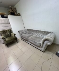 Classic Chesterfield-style furniture upholstered in velvet, featuring a long grey or silver sofa with a button-tufted backrest, accompanied by a matching armchair (fauteuil) in a dark green or olive shade, sharing the same plush, classic design. - Image 11