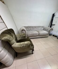 Classic Chesterfield-style furniture upholstered in velvet, featuring a long grey or silver sofa with a button-tufted backrest, accompanied by a matching armchair (fauteuil) in a dark green or olive shade, sharing the same plush, classic design. - Image 13