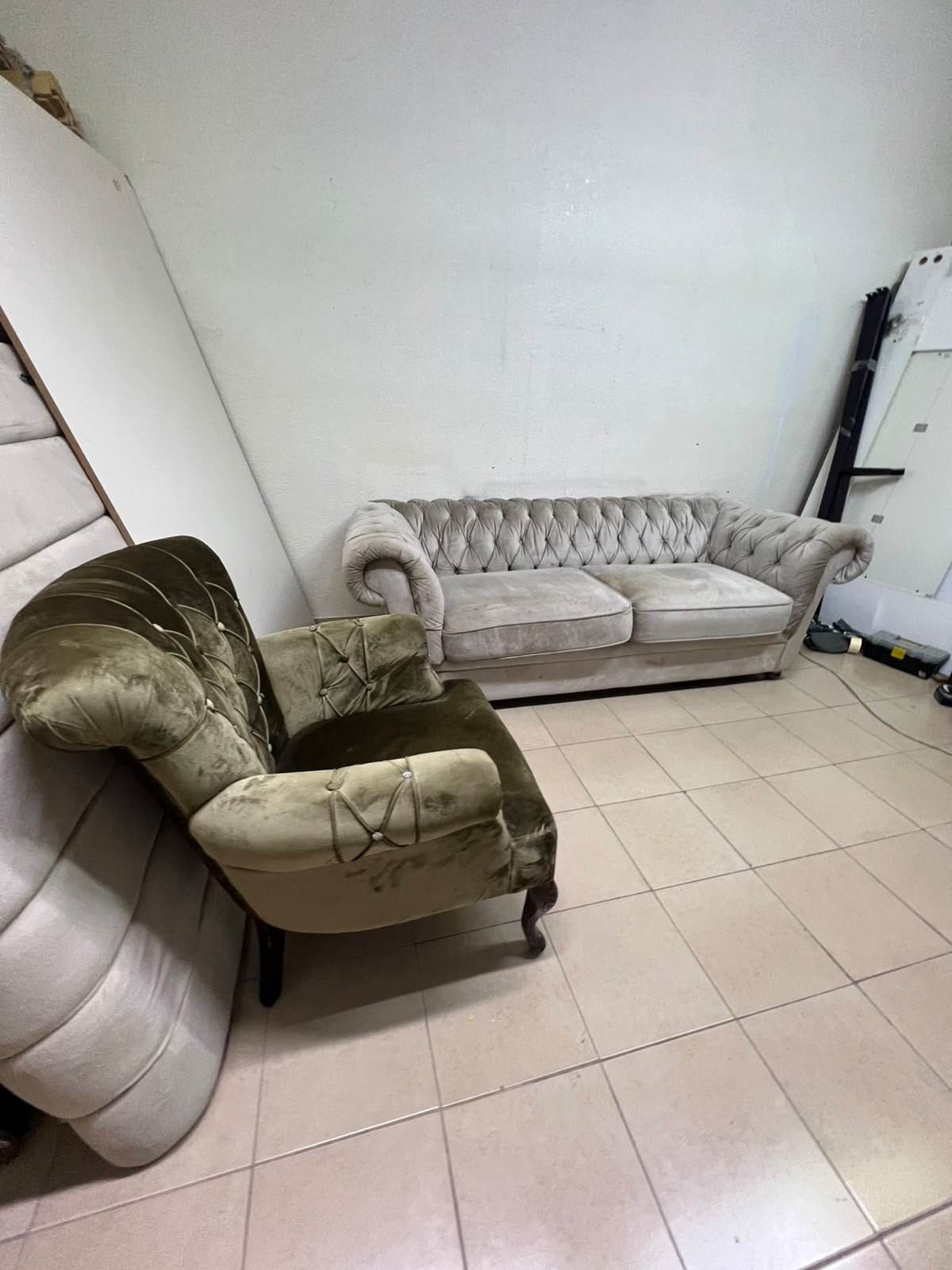 Classic Chesterfield-style furniture upholstered in velvet, featuring a long grey or silver sofa with a button-tufted backrest, accompanied by a matching armchair (fauteuil) in a dark green or olive shade, sharing the same plush, classic design. - Image 13