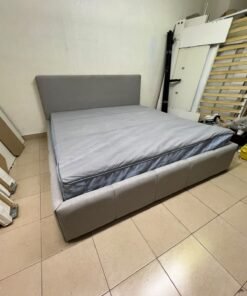 Light gray upholstered bed featuring a high headboard with a vertical channel-tufted design; part of a collection of platform storage beds. - Image 11