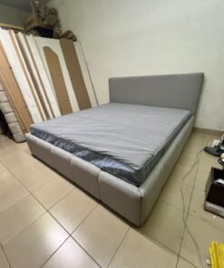 Light gray upholstered bed featuring a high headboard with a vertical channel-tufted design; part of a collection of platform storage beds. - Image 5