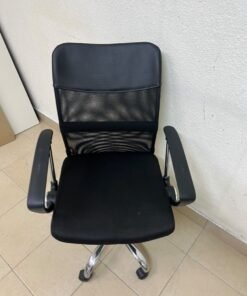 A black office chair featuring a comfortable mesh back, a chrome metal base with casters, armrests, and adjustable height. - Image 2