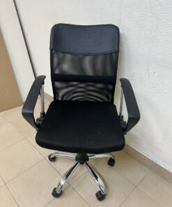 A black office chair featuring a comfortable mesh back, a chrome metal base with casters, armrests, and adjustable height. - Image 5