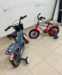 Two children’s bicycles in different colors (blue and red), equipped with training wheels and front baskets. - Image 7