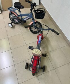 Two children’s bicycles in different colors (blue and red), equipped with training wheels and front baskets. - Image 10