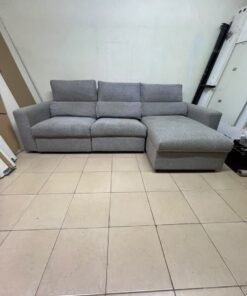 A grey L-shaped sofa bed with a high backrest and recliner seat, which closely matches the IKEA ESKILSTUNA model. Includes storage. - Image 6