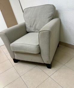 A single-seater fabric armchair in beige or light gray, featuring a separate seat cushion and back cushion, along with small black legs. - Image 6