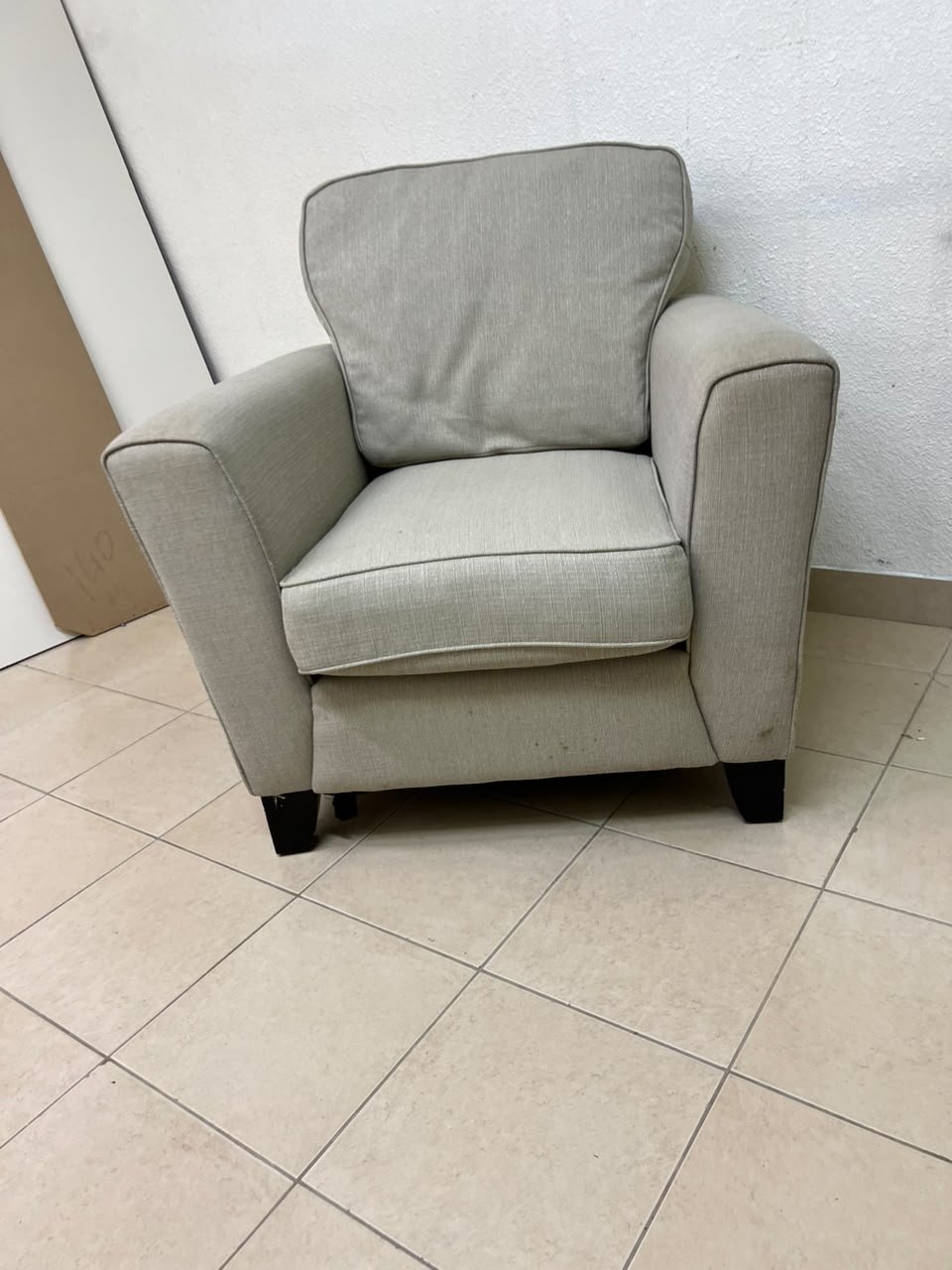 A single-seater fabric armchair in beige or light gray, featuring a separate seat cushion and back cushion, along with small black legs. - Image 7
