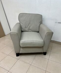 A single-seater fabric armchair in beige or light gray, featuring a separate seat cushion and back cushion, along with small black legs. - Image 8