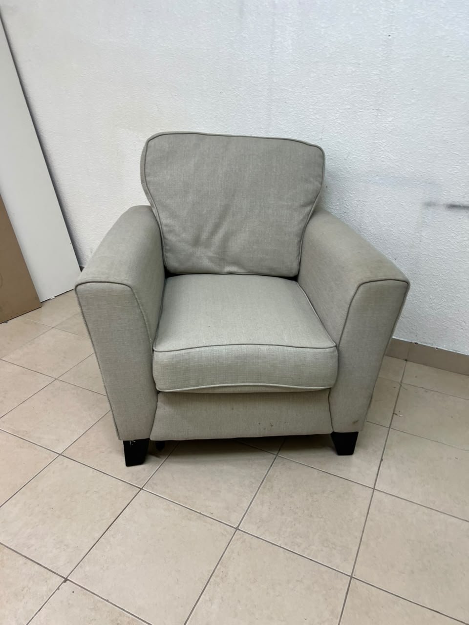 A single-seater fabric armchair in beige or light gray, featuring a separate seat cushion and back cushion, along with small black legs. - Image 8