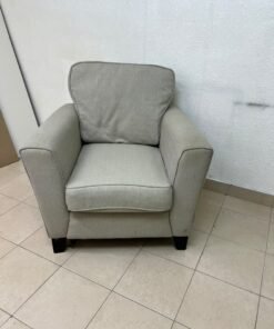 A single-seater fabric armchair in beige or light gray, featuring a separate seat cushion and back cushion, along with small black legs. - Image 5