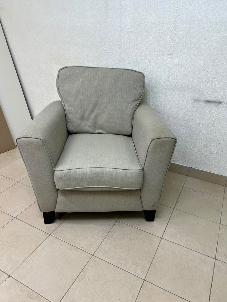 A single-seater fabric armchair in beige or light gray, featuring a separate seat cushion and back cushion, along with small black legs. - Image 5