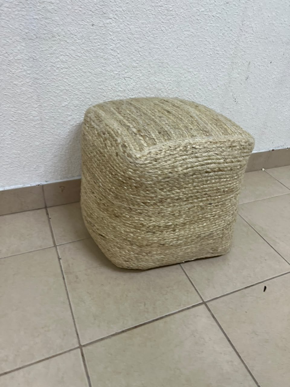 A square-shaped pouf made from braided natural jute fibers. - Image 8