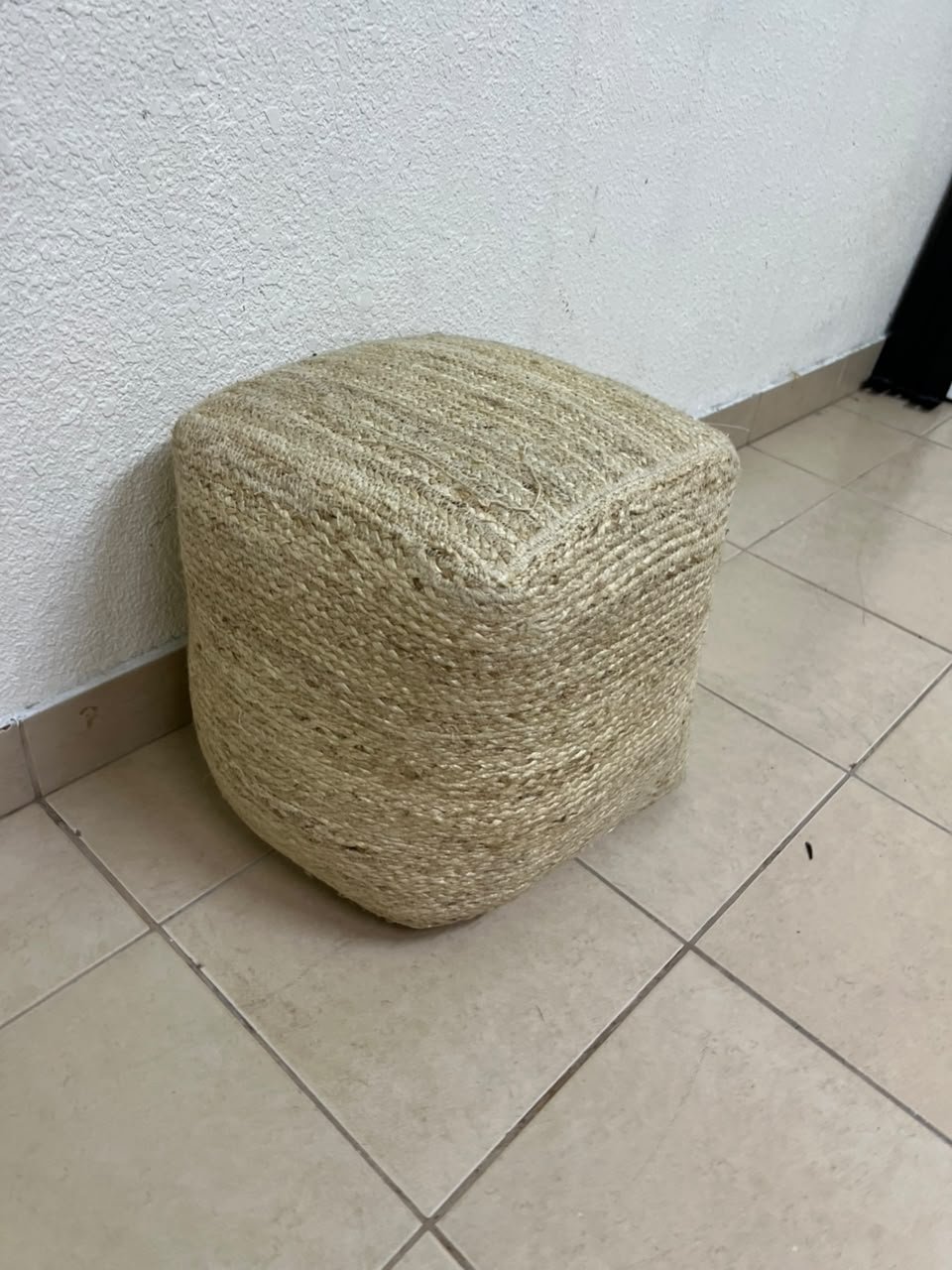 A square-shaped pouf made from braided natural jute fibers. - Image 9