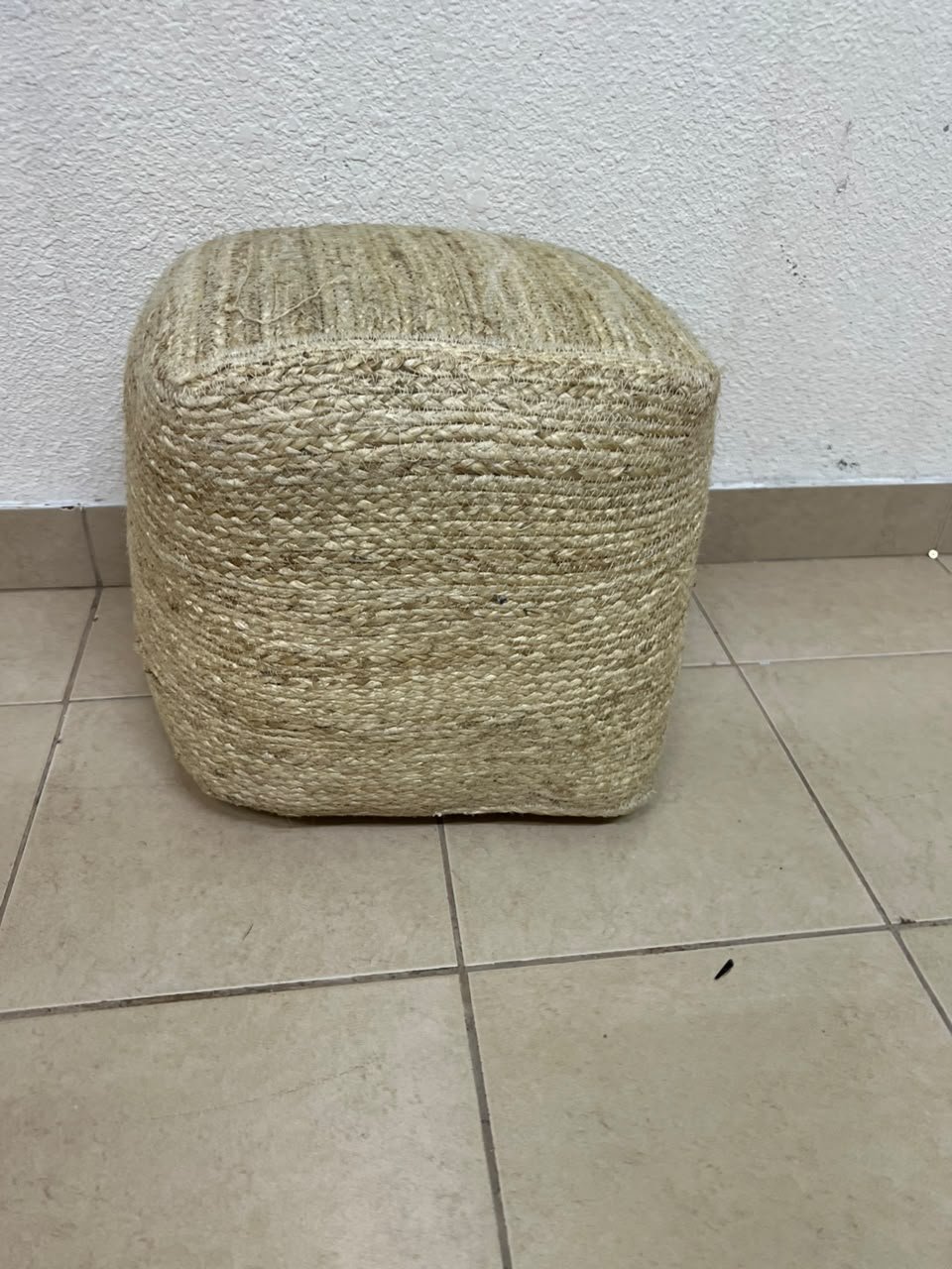 A square-shaped pouf made from braided natural jute fibers. - Image 10