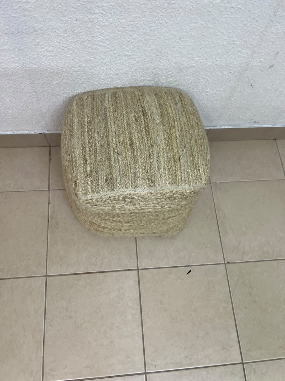 A square-shaped pouf made from braided natural jute fibers. - Image 3