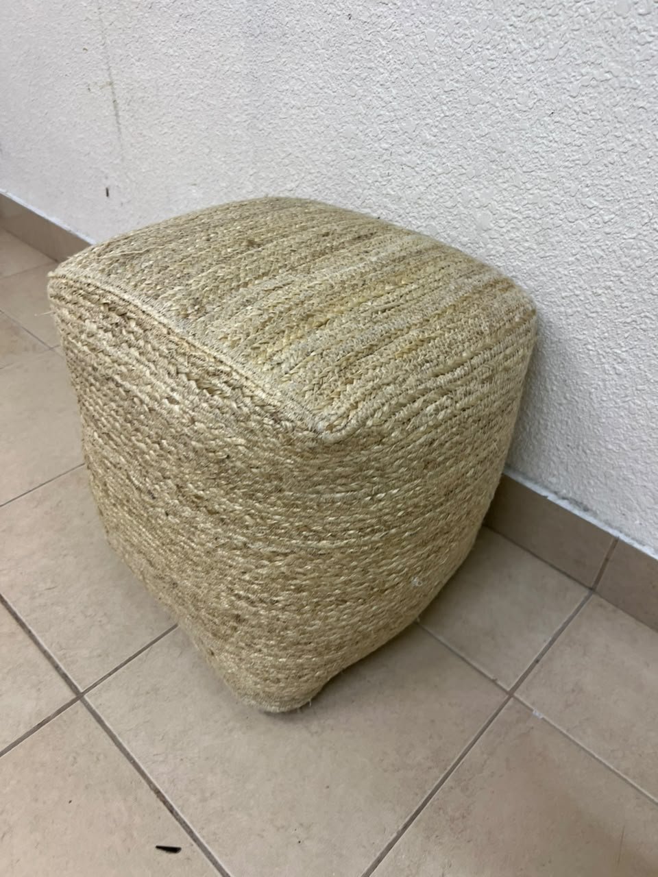 A square-shaped pouf made from braided natural jute fibers. - Image 4