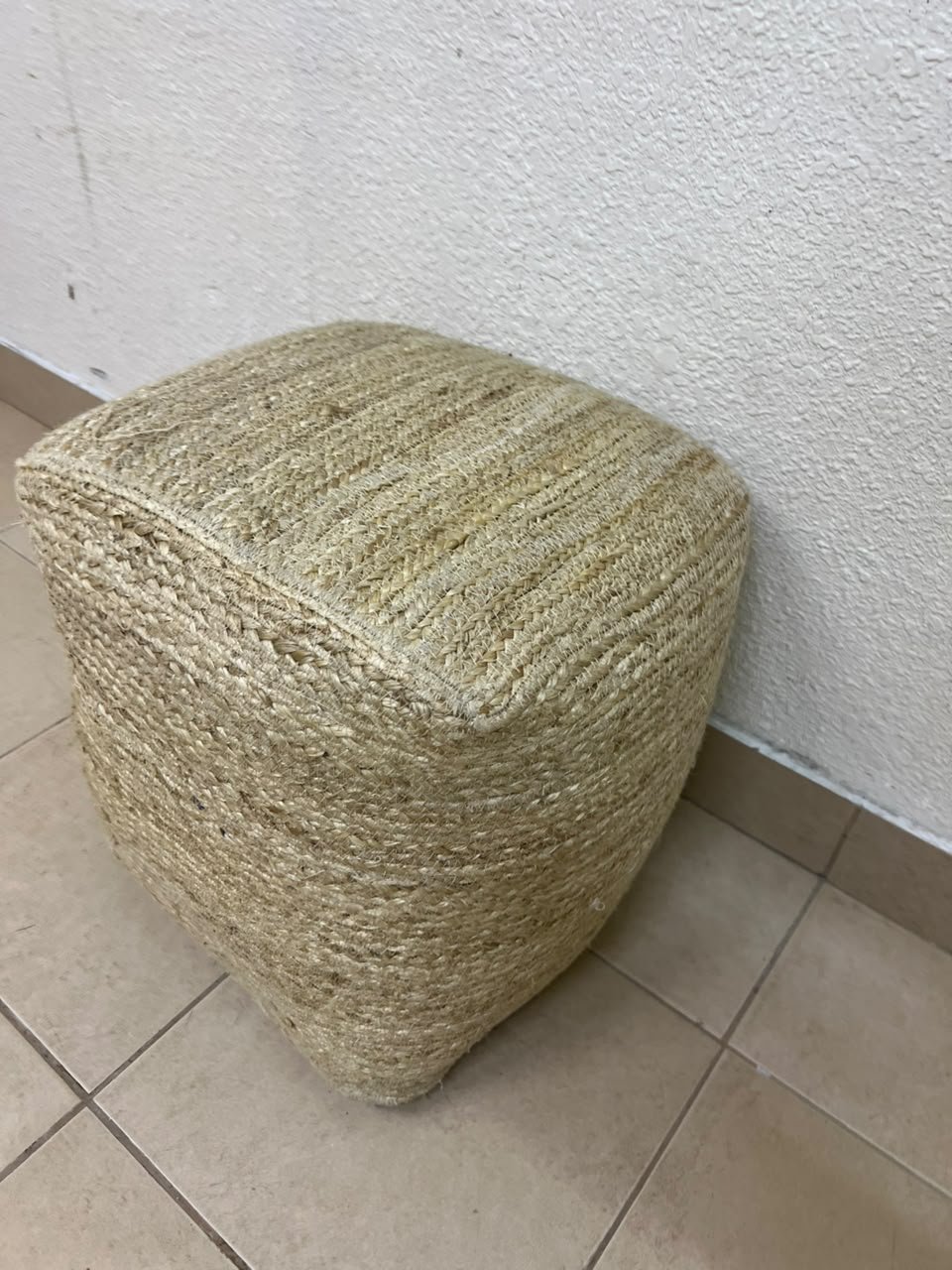 A square-shaped pouf made from braided natural jute fibers. - Image 6