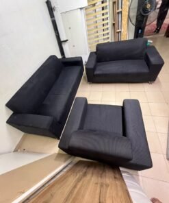 A black sofa set consisting of a large sofa (3-seater), a medium sofa (2-seater), and an armchair (1-seater), featuring wide armrests and modern metal legs. From Home Centre. - Image 2