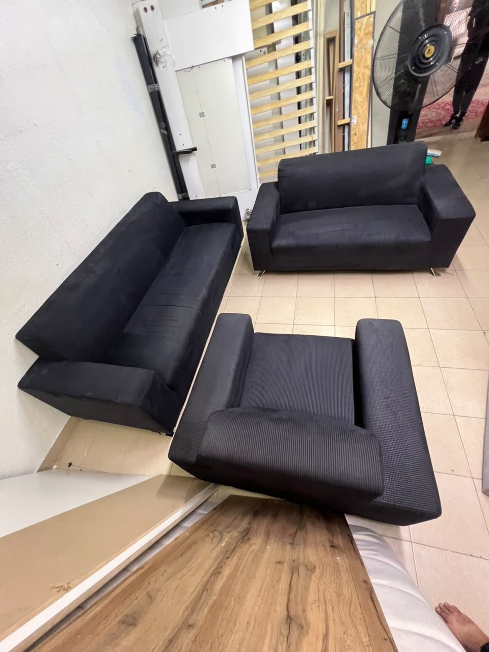 A black sofa set consisting of a large sofa (3-seater), a medium sofa (2-seater), and an armchair (1-seater), featuring wide armrests and modern metal legs. From Home Centre. - Image 2