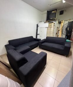 A black sofa set consisting of a large sofa (3-seater), a medium sofa (2-seater), and an armchair (1-seater), featuring wide armrests and modern metal legs. From Home Centre. - Image 5