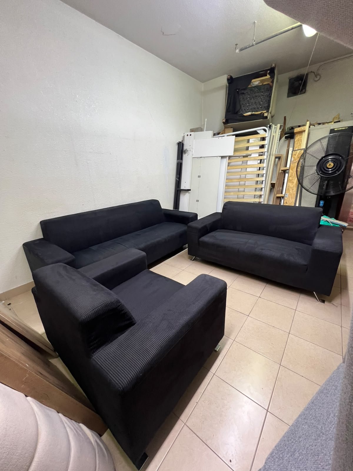 A black sofa set consisting of a large sofa (3-seater), a medium sofa (2-seater), and an armchair (1-seater), featuring wide armrests and modern metal legs. From Home Centre. - Image 5