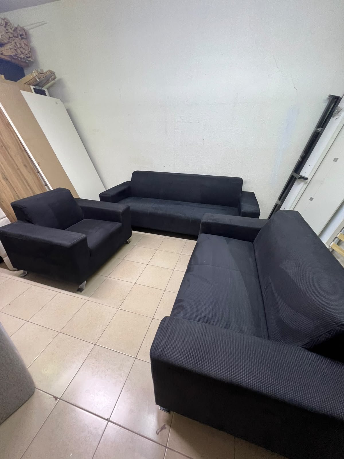 A black sofa set consisting of a large sofa (3-seater), a medium sofa (2-seater), and an armchair (1-seater), featuring wide armrests and modern metal legs. From Home Centre. - Image 6