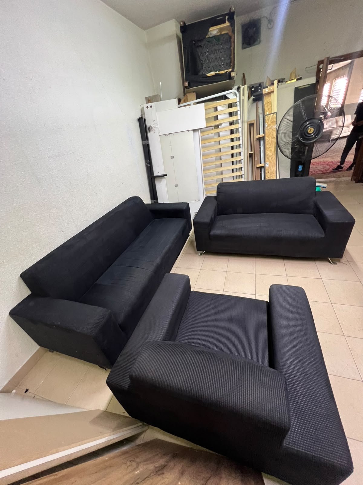 A black sofa set consisting of a large sofa (3-seater), a medium sofa (2-seater), and an armchair (1-seater), featuring wide armrests and modern metal legs. From Home Centre. - Image 7