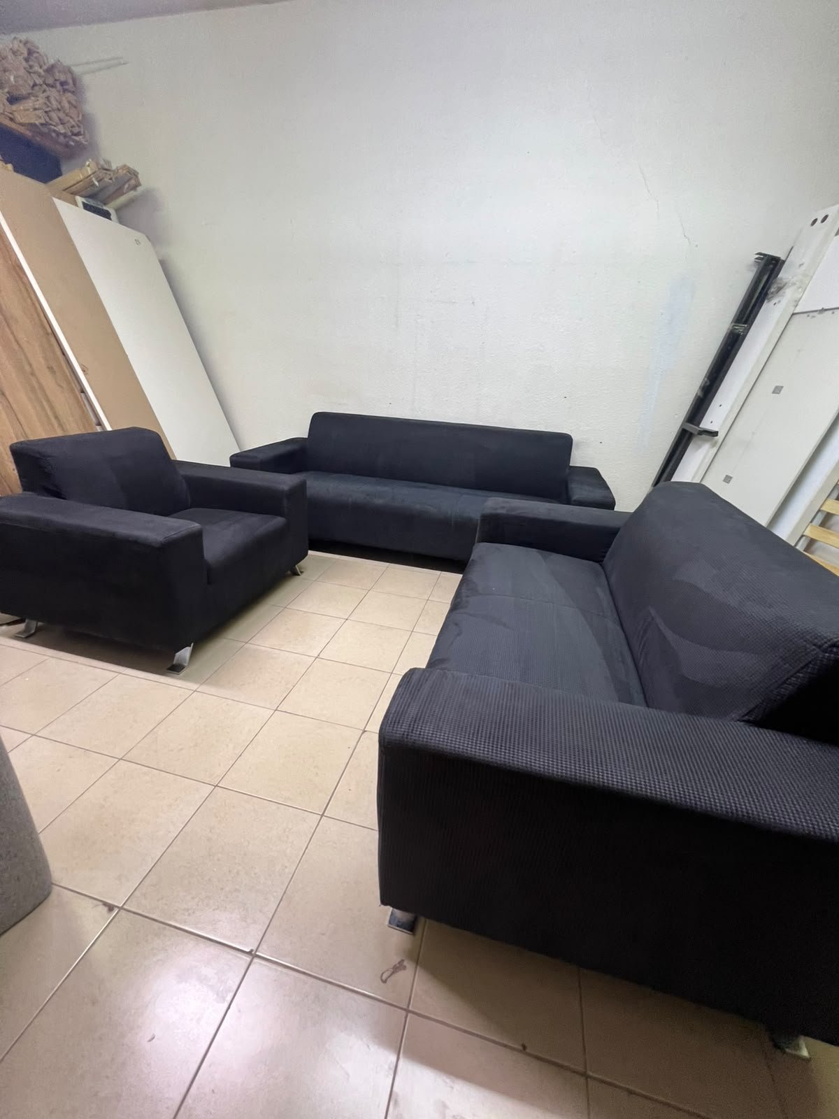 A black sofa set consisting of a large sofa (3-seater), a medium sofa (2-seater), and an armchair (1-seater), featuring wide armrests and modern metal legs. From Home Centre. - Image 13