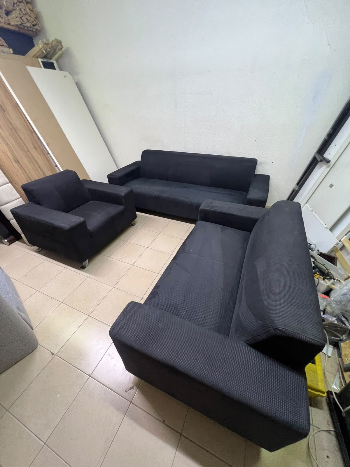 A black sofa set consisting of a large sofa (3-seater), a medium sofa (2-seater), and an armchair (1-seater), featuring wide armrests and modern metal legs. From Home Centre. - Image 9