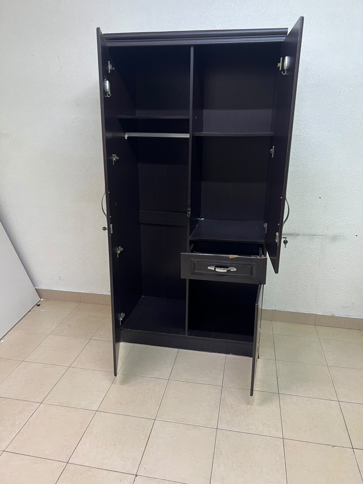 A dark brown (wenge-colored) wooden wardrobe featuring two doors—one of which has an upper mirror—along with a central drawer and a small cabinet (door) at the bottom. - Image 9