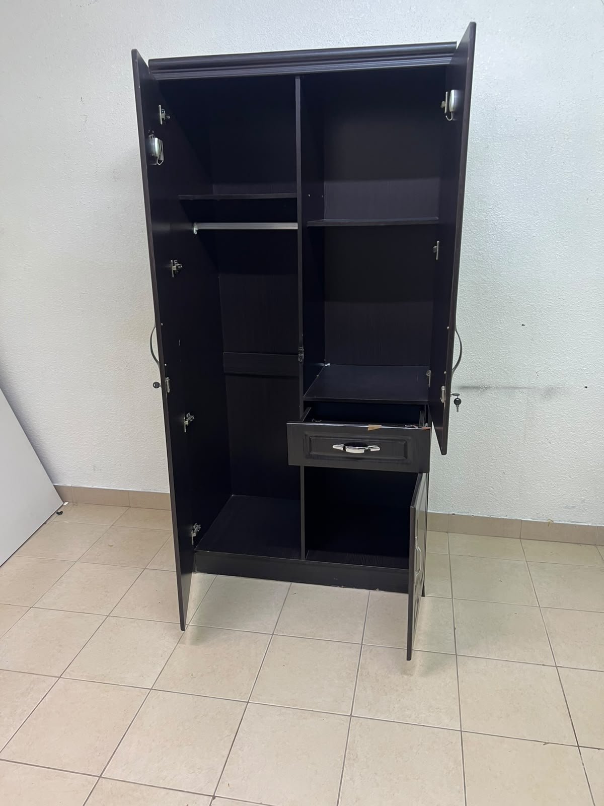 A dark brown (wenge-colored) wooden wardrobe featuring two doors—one of which has an upper mirror—along with a central drawer and a small cabinet (door) at the bottom. - Image 11