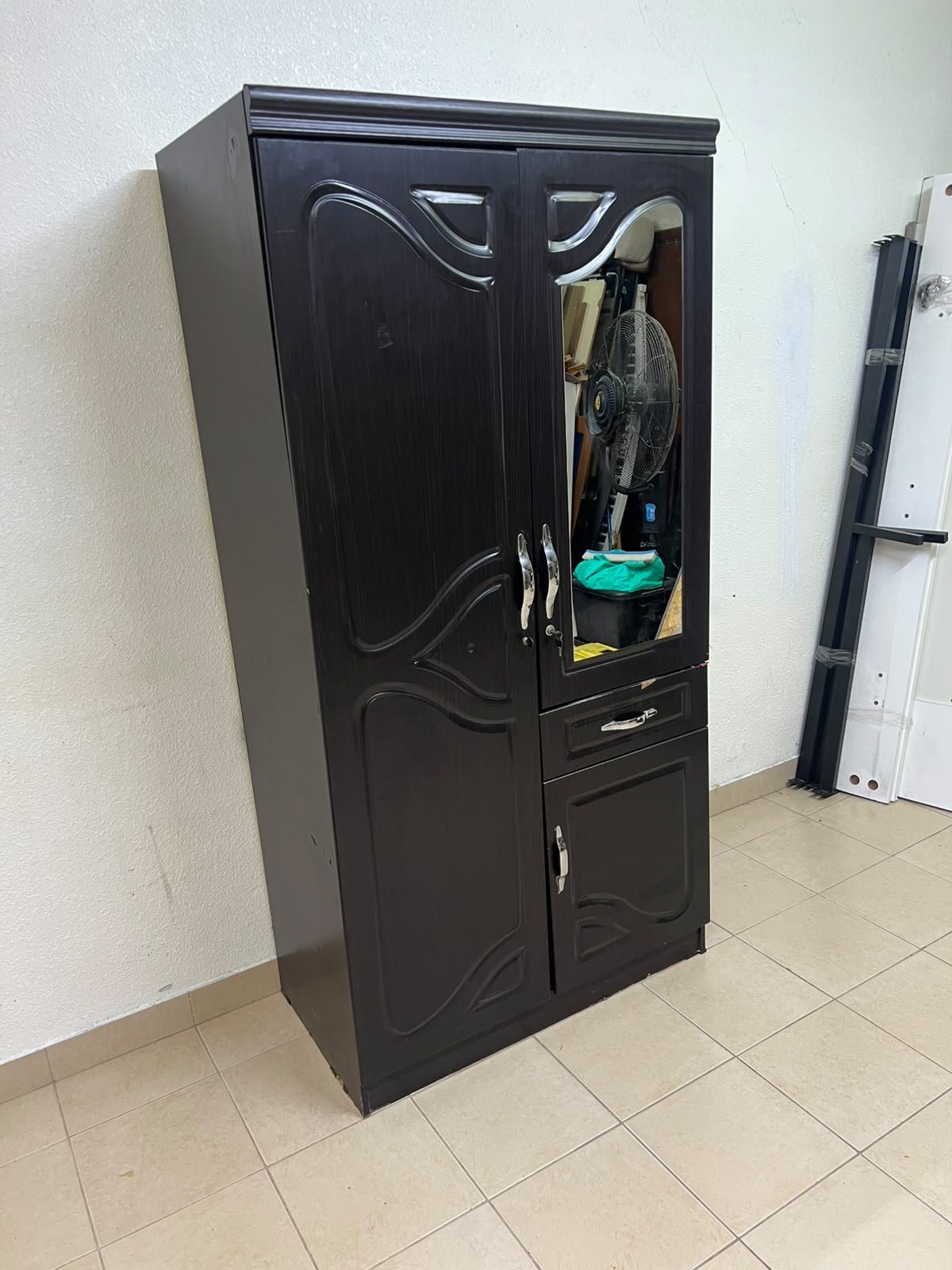A dark brown (wenge-colored) wooden wardrobe featuring two doors—one of which has an upper mirror—along with a central drawer and a small cabinet (door) at the bottom. - Image 5