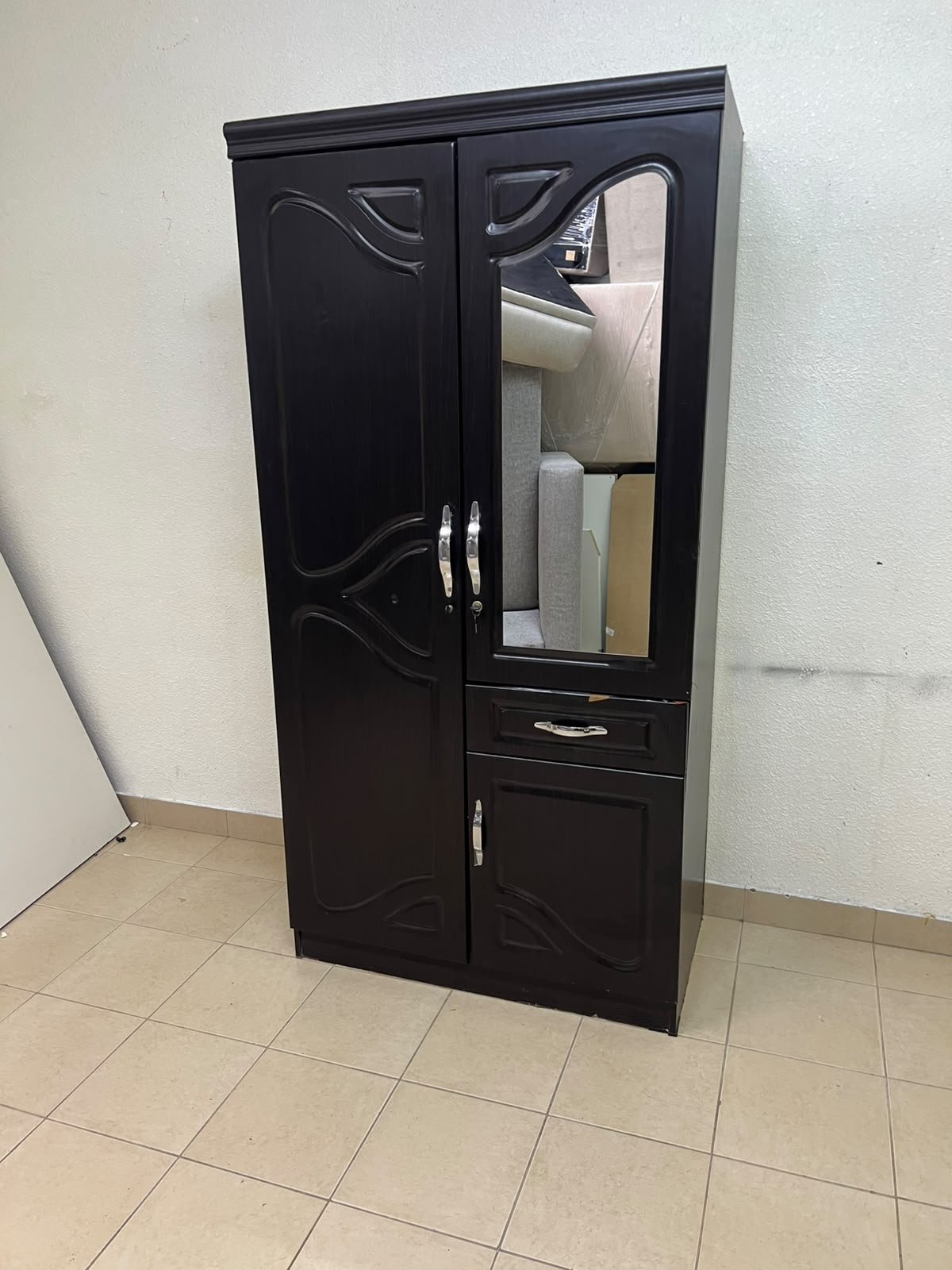 A dark brown (wenge-colored) wooden wardrobe featuring two doors—one of which has an upper mirror—along with a central drawer and a small cabinet (door) at the bottom. - Image 12